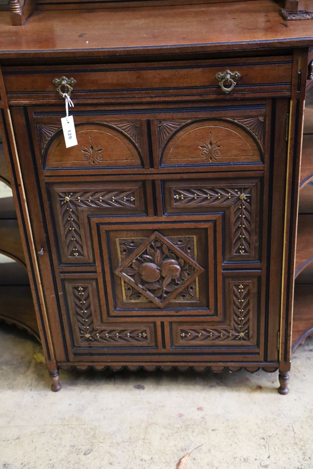 A late Victorian aesthetic movement mahogany side cabinet, width 150cm, depth 43cm, height 147cm